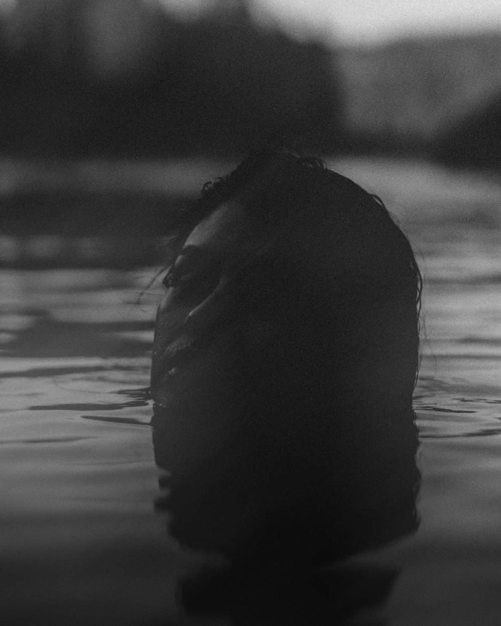 grayscale photo of woman in water