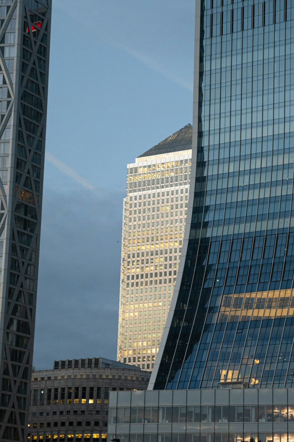 blue glass walled high rise building