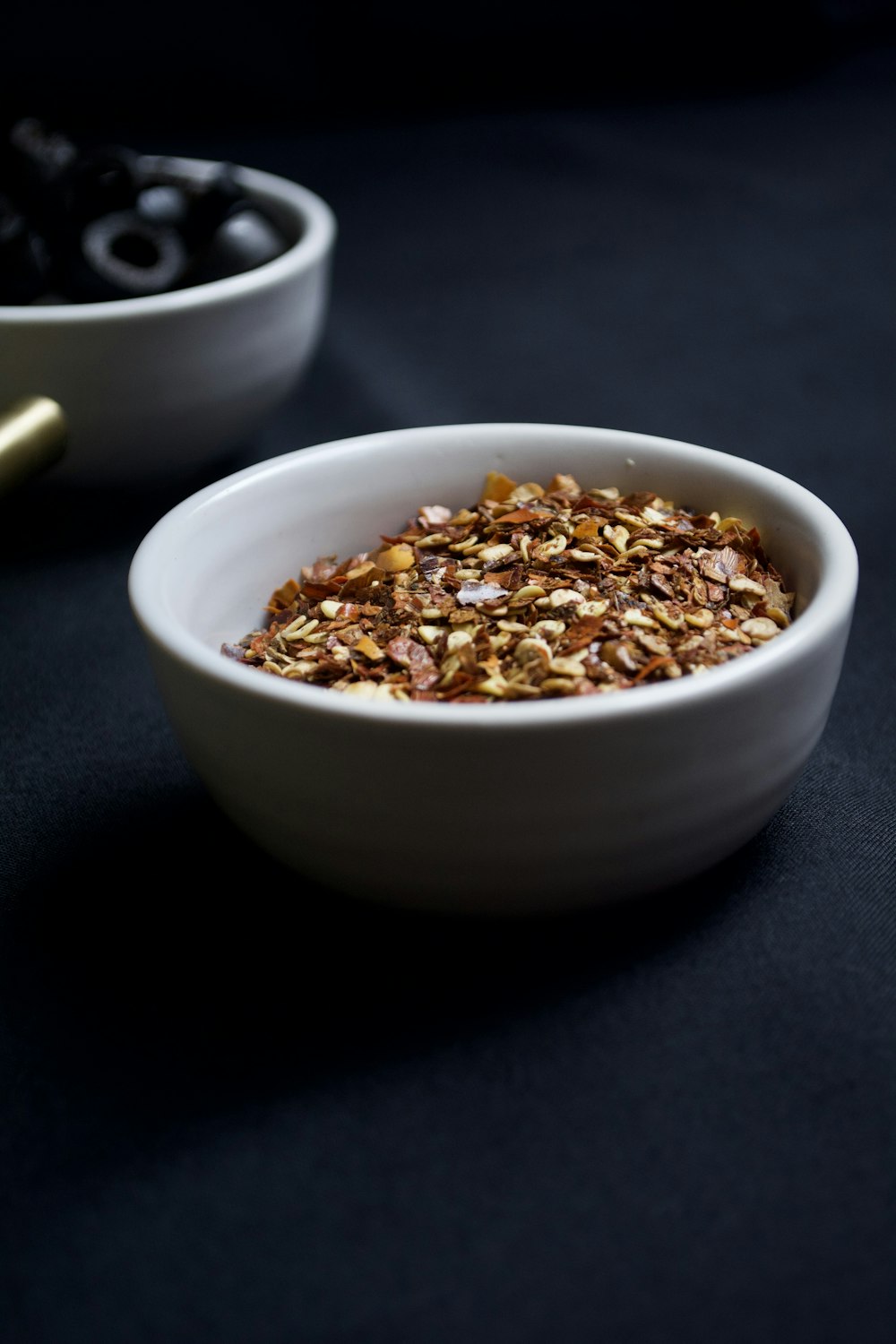 brown beans in white ceramic bowl