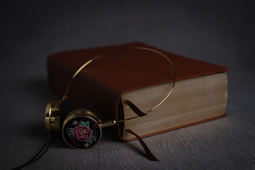 gold and black analog watch