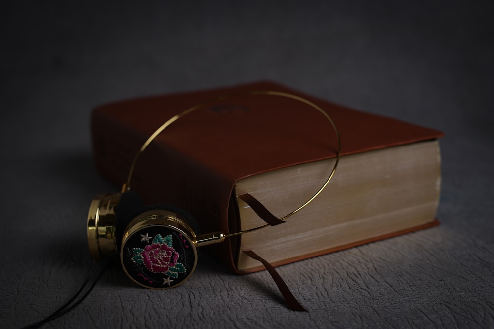 gold and black analog watch