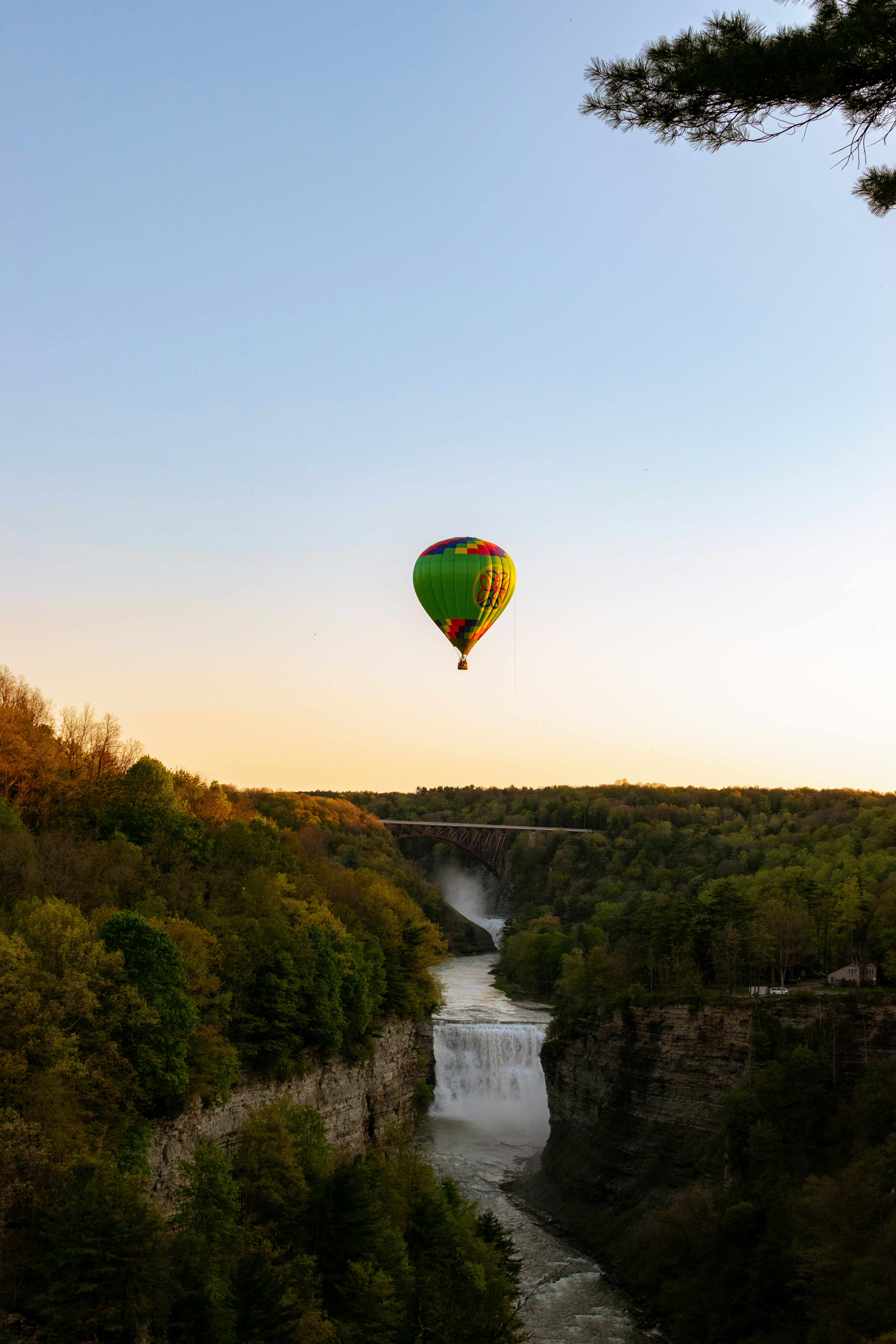 hot air balloons flying over river during daytime photo Free