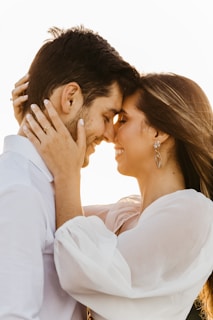 man and woman kissing