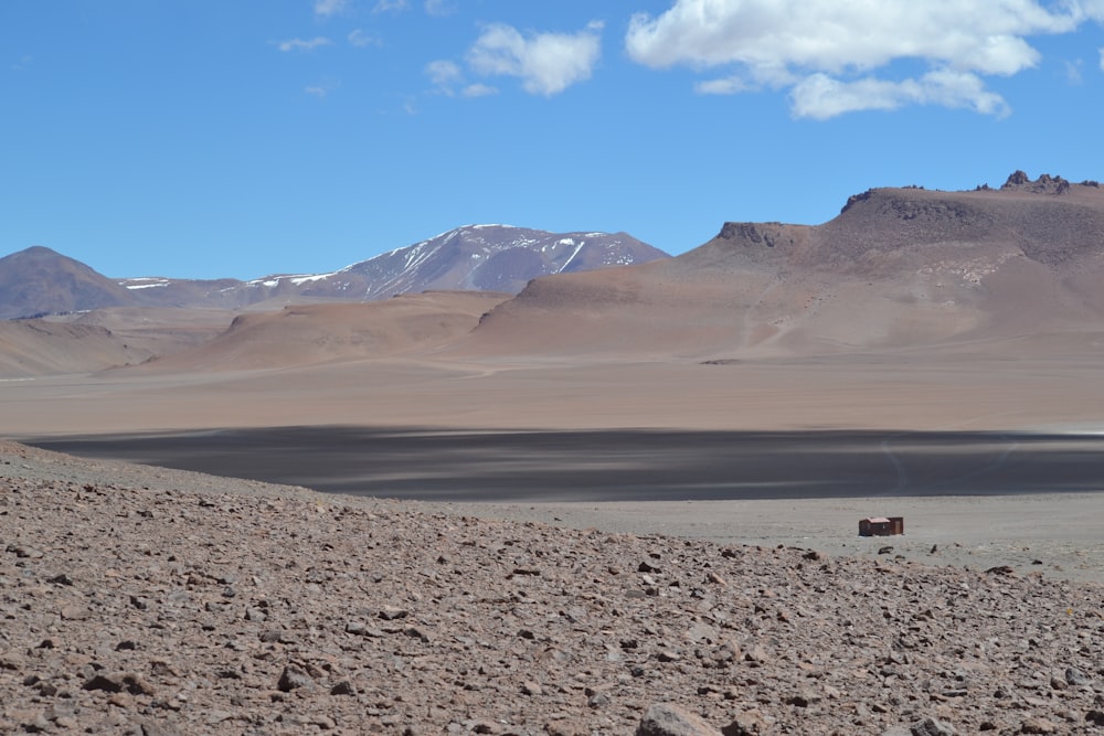 brown sand and mountains during daytime