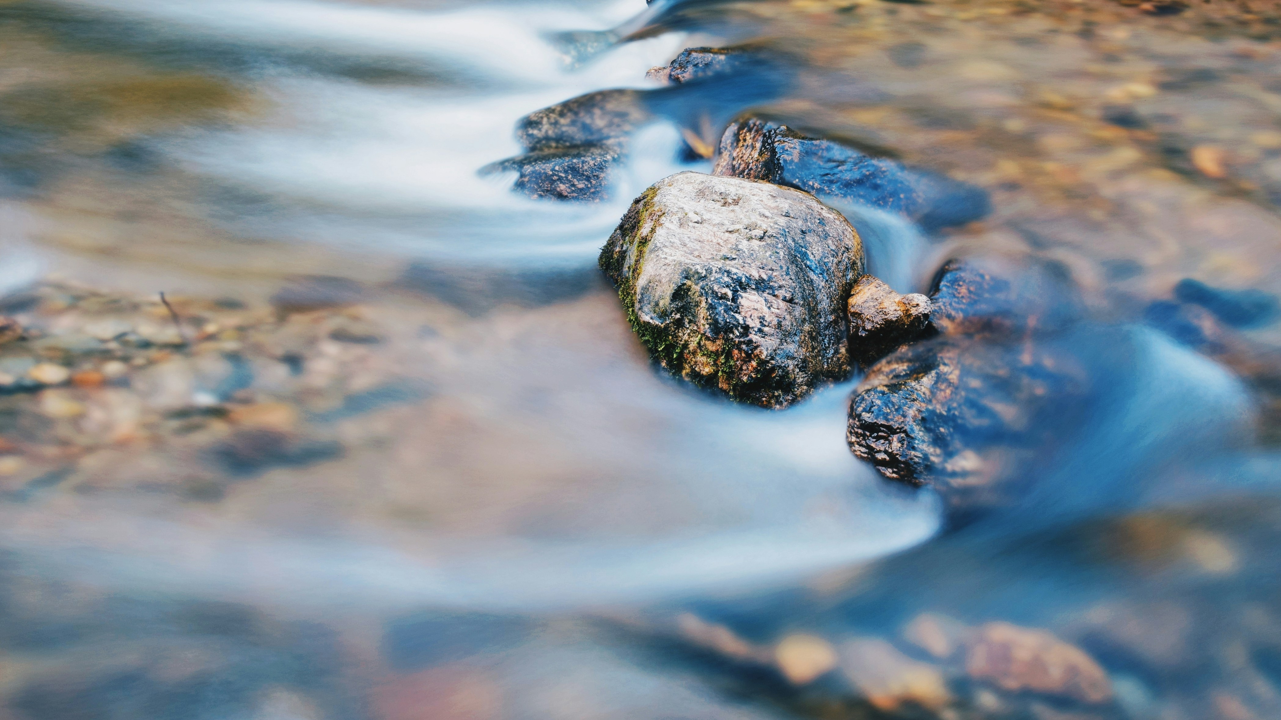 black and gray stone on water