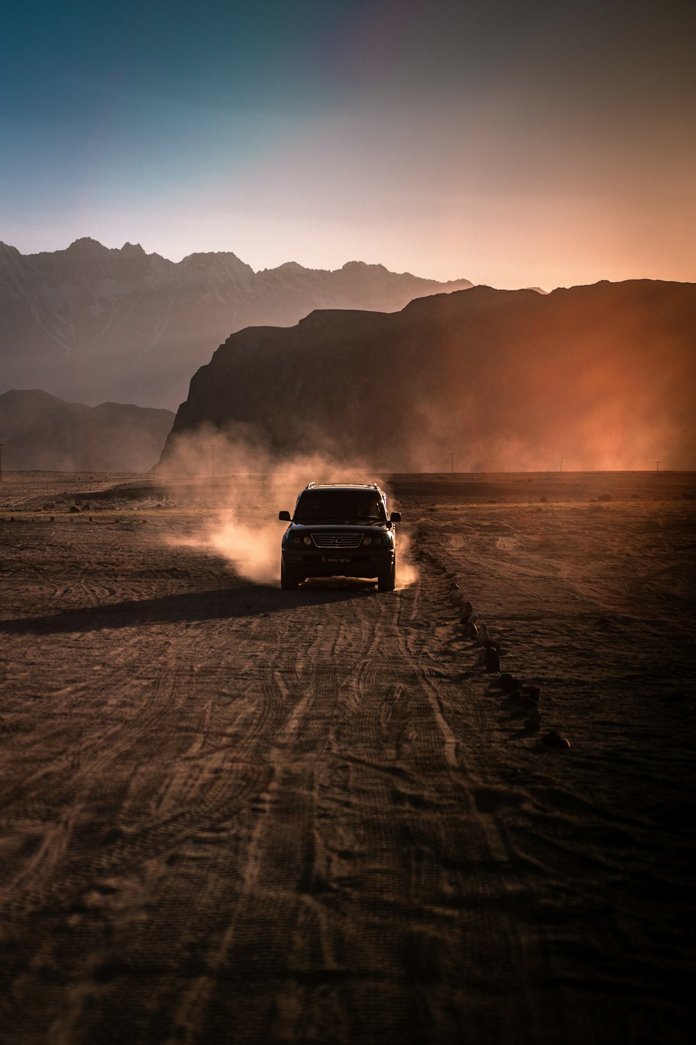 black chevrolet car on beach during sunset