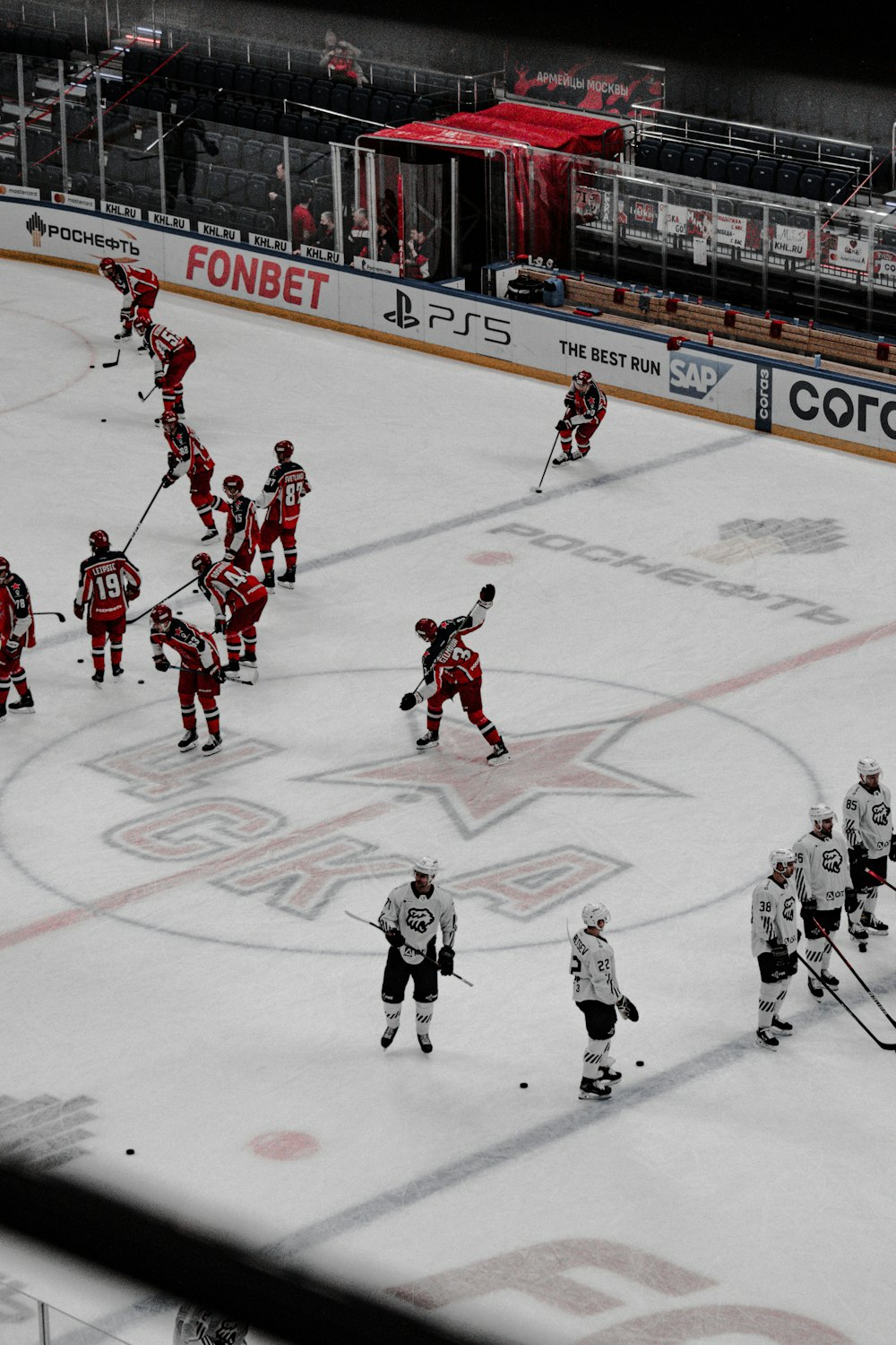 people playing ice hockey on ice stadium