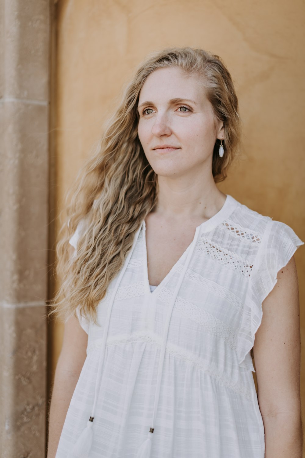 woman in white sleeveless dress