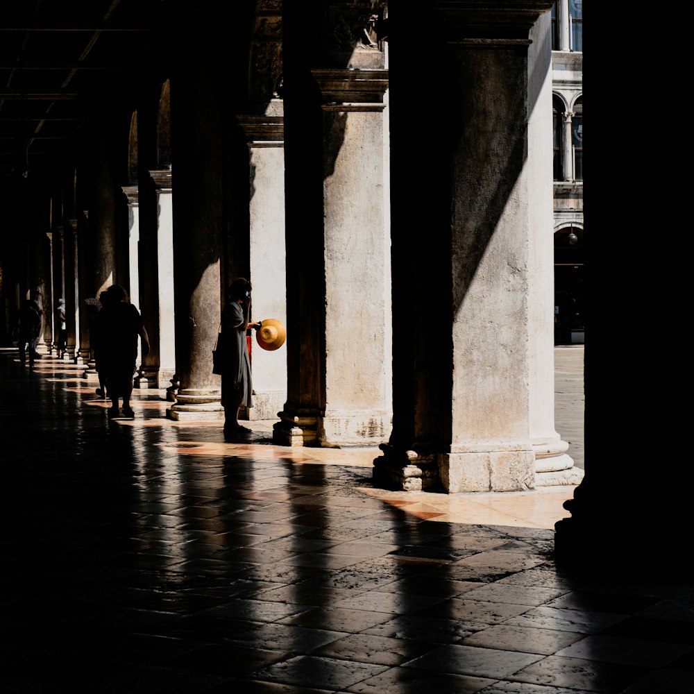 people walking on hallway during daytime