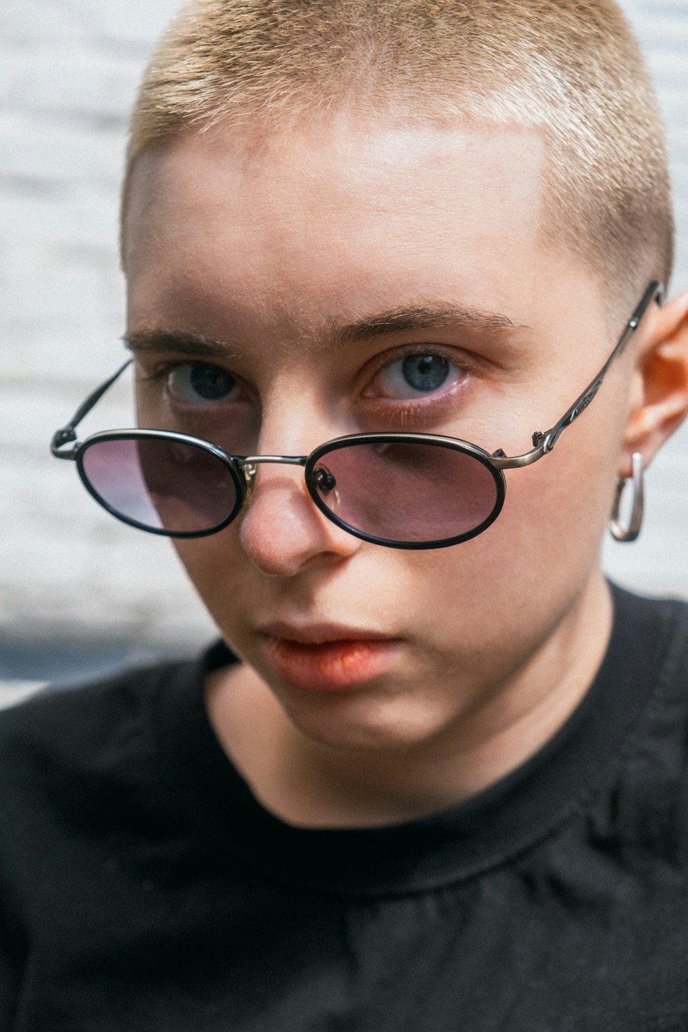 boy in black crew neck shirt wearing black framed eyeglasses