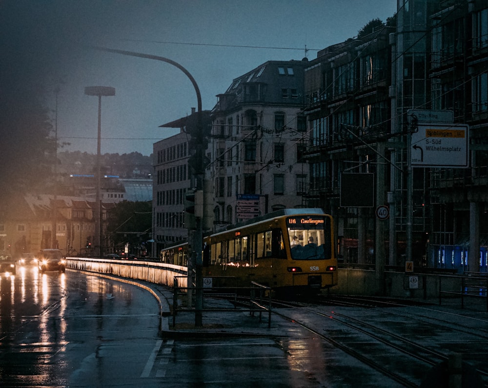 yellow and black bus on road during daytime