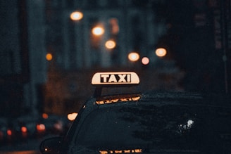 black car on road during night time