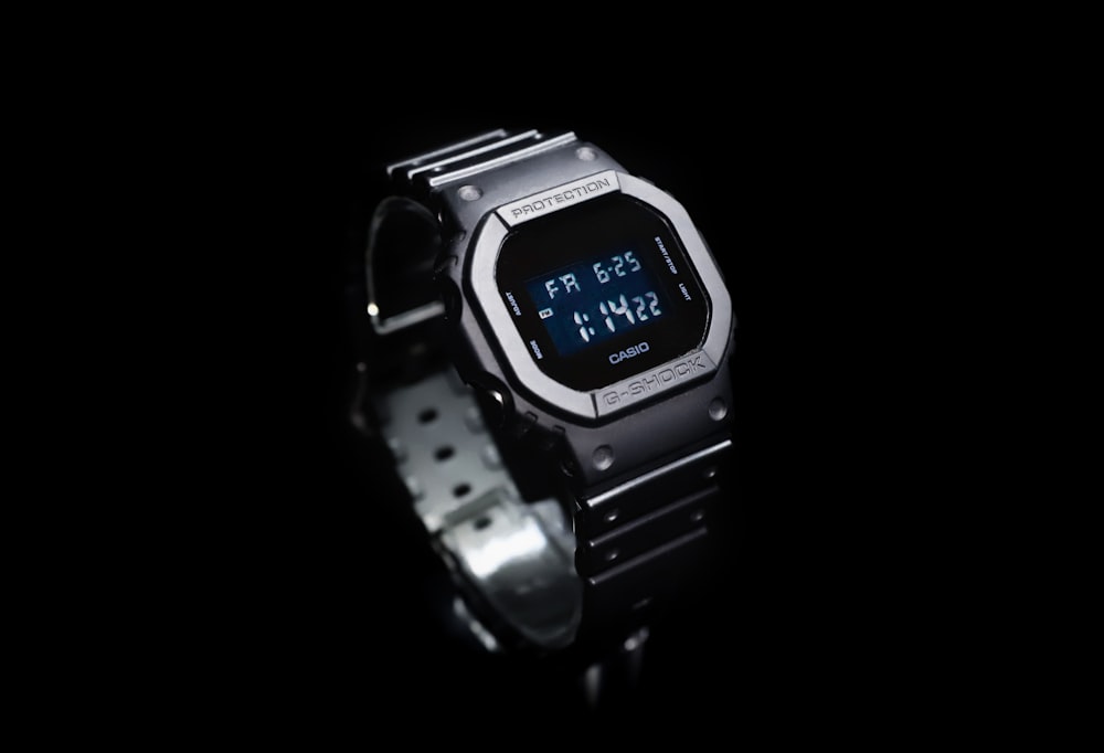 silver and black casio digital watch