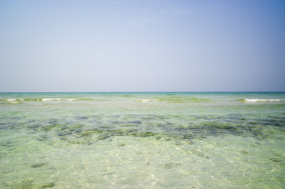 blue ocean water under blue sky during daytime