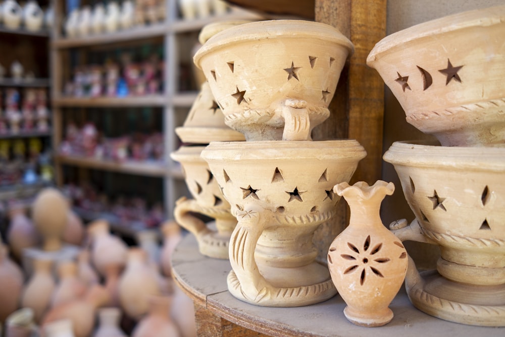 a group of clay pots sitting on top of a table