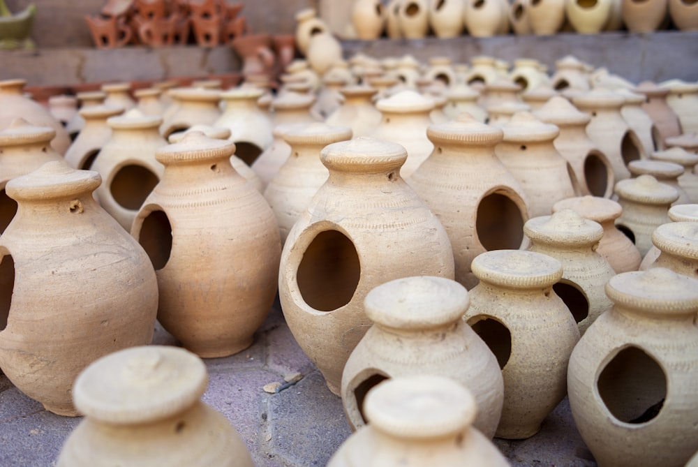 white clay vases on gray concrete floor