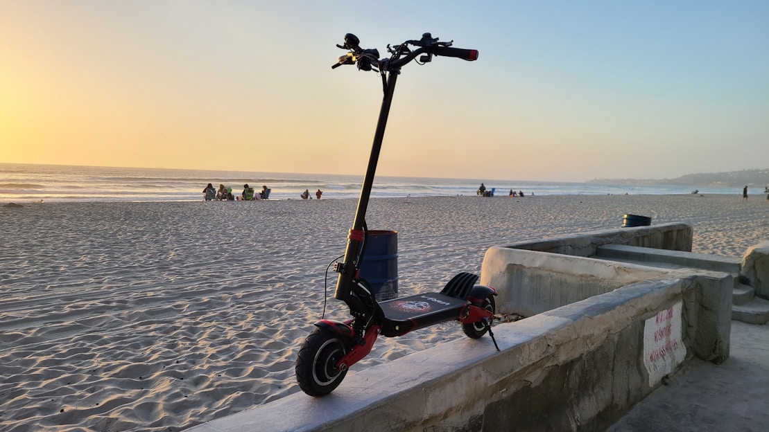 black and red motorcycle on gray concrete dock during daytime