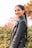 woman in black leather jacket smiling