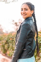 woman in black leather jacket