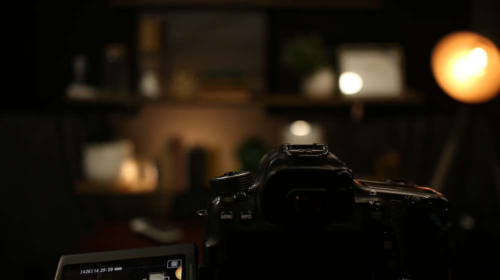 black dslr camera on table