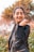 woman in black leather jacket smiling