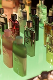 four perfume bottles on white table