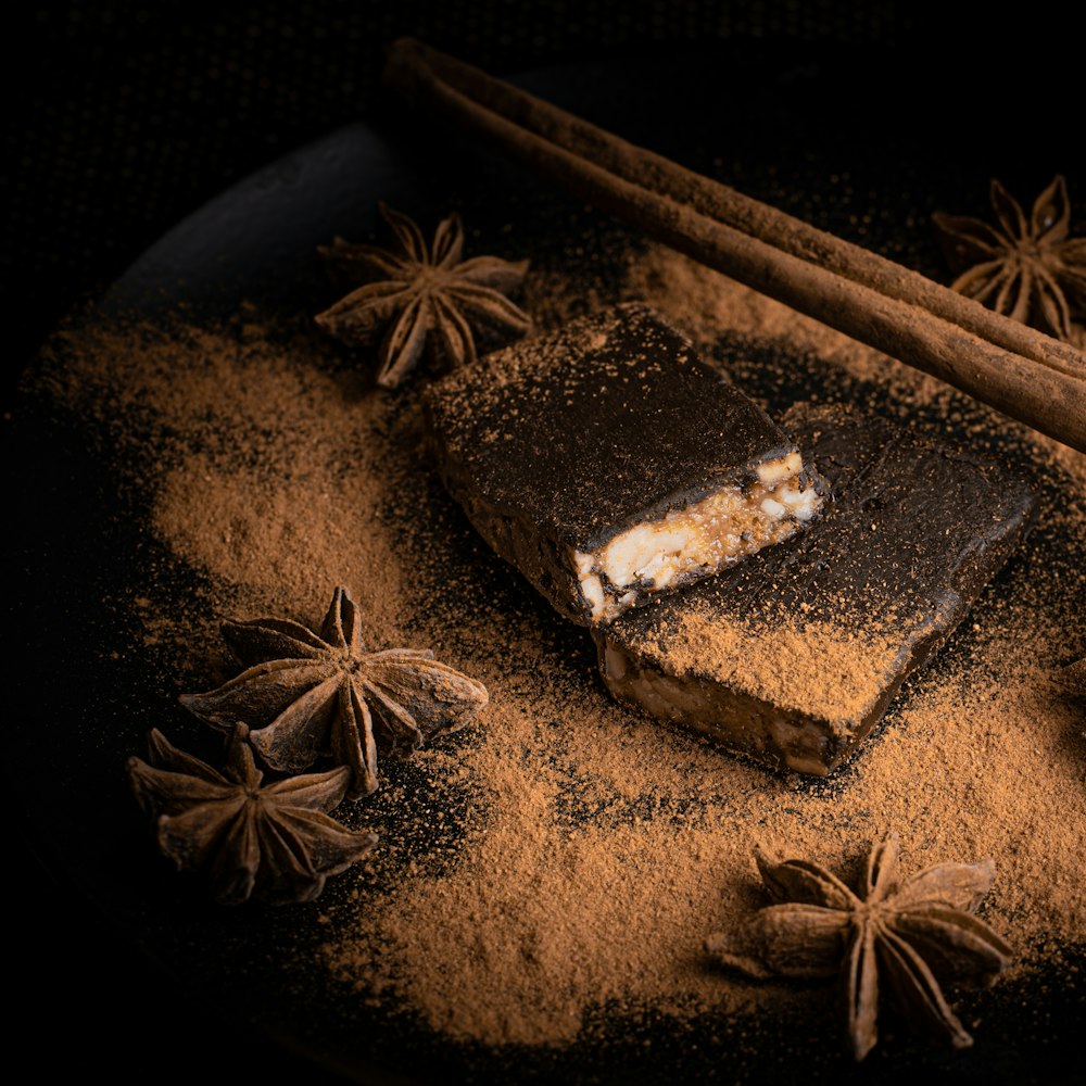 brown and white chocolate bar on brown and black floral textile