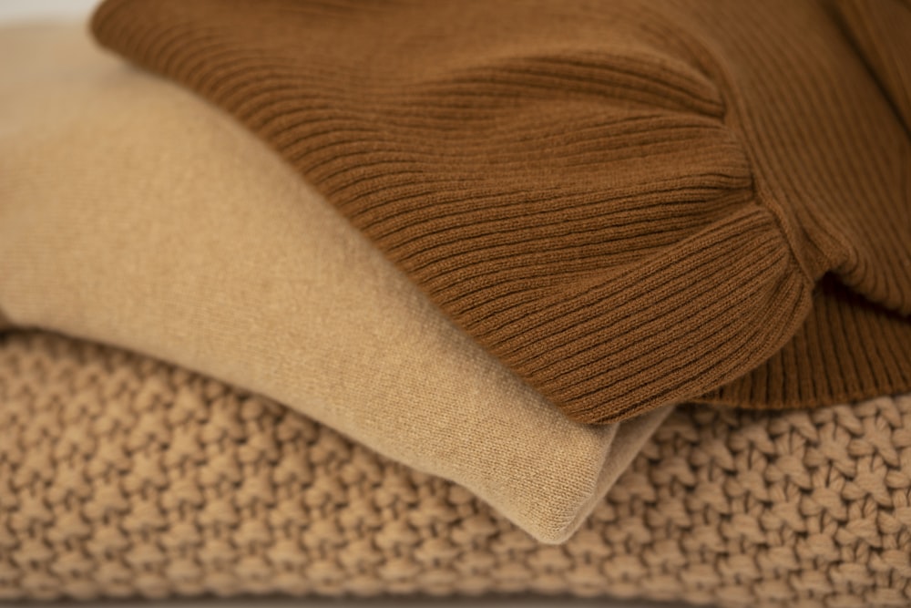 brown and white knit textile