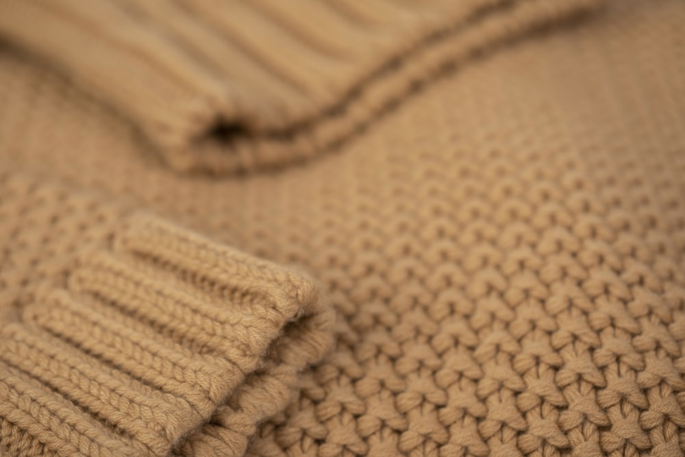 brown knit textile in close up photography
