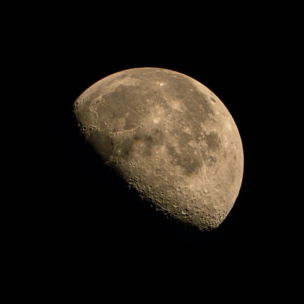 a close up of a half moon in the sky