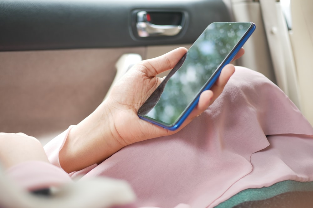 person holding black android smartphone