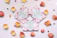 Close-up of a delicate handmade shaker card with floral accents on a vintage wooden table.