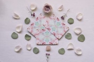 pink and white floral print paper on white surface