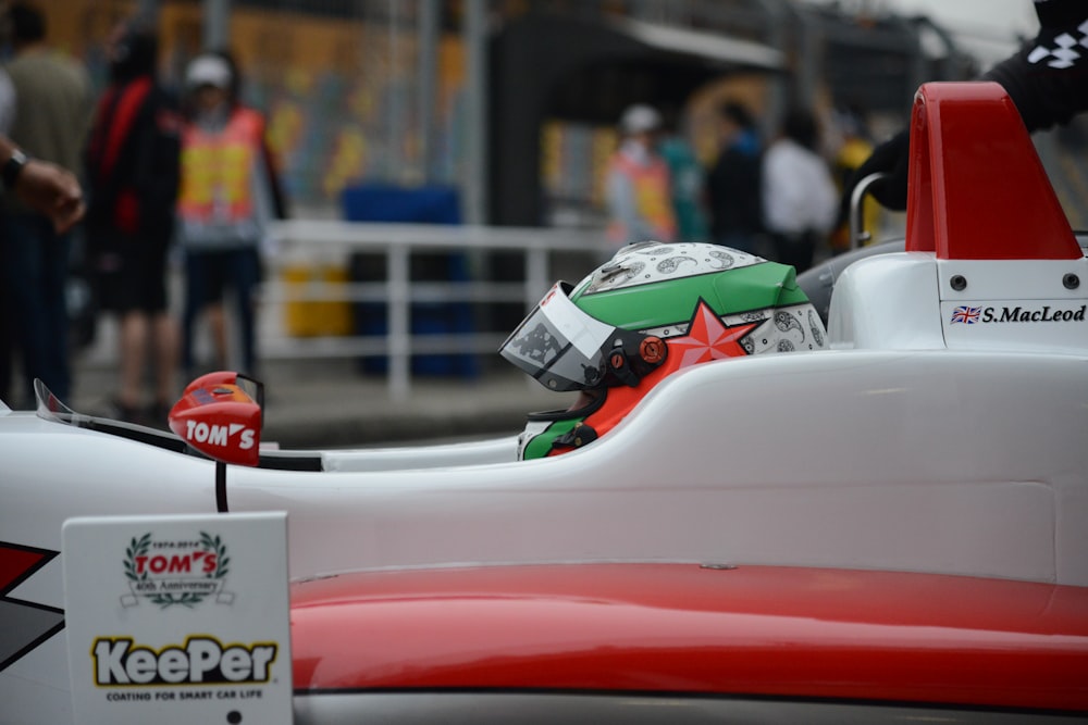 red and white ferrari f 1 race car