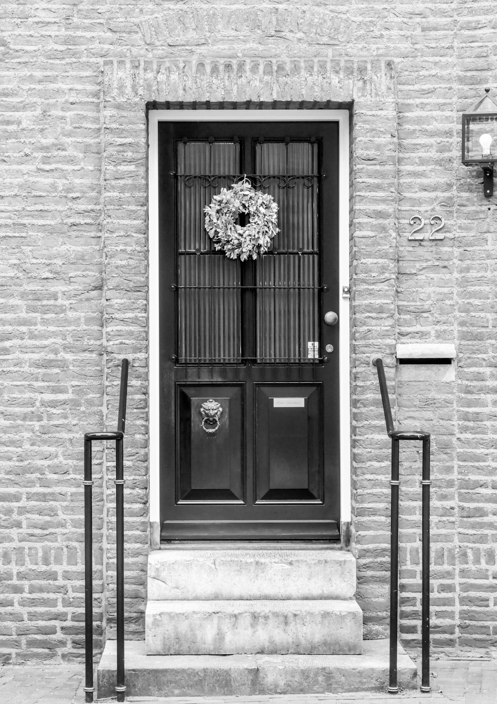 black wooden door on gray concrete building