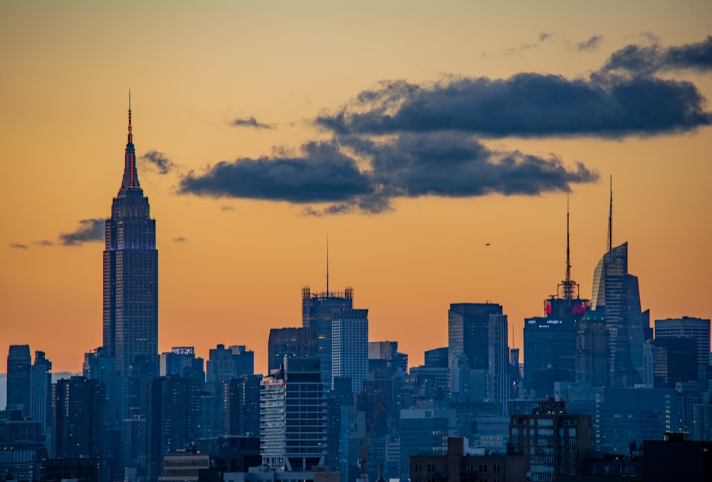 city skyline under cloudy sky during daytime