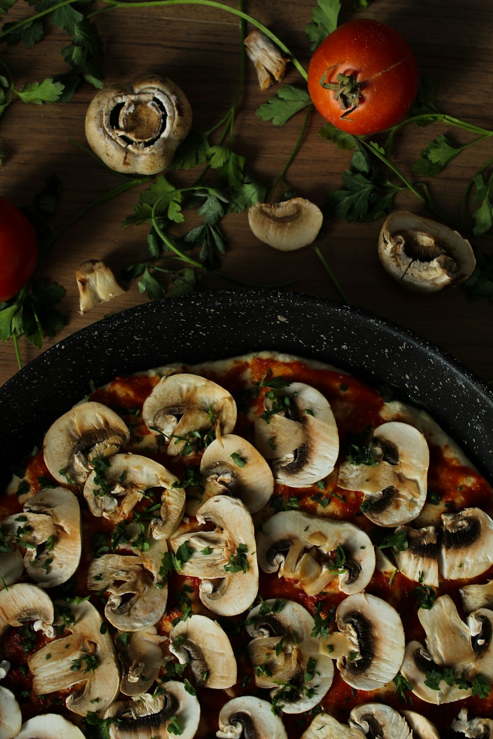 sliced mushroom on black ceramic plate