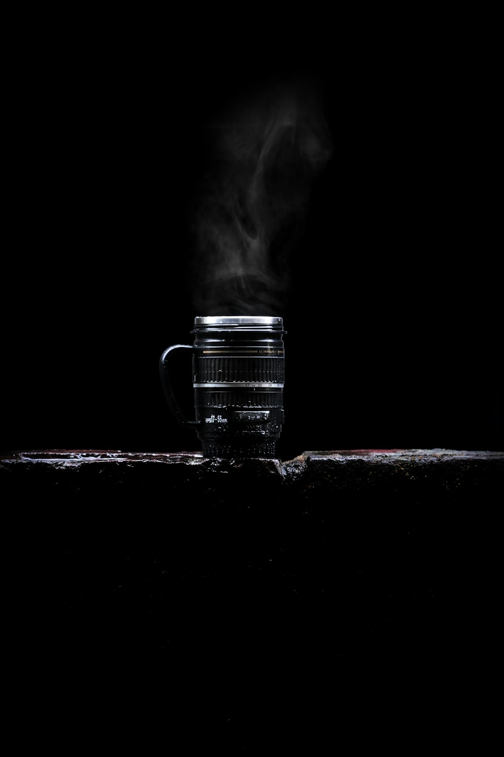 grayscale photo of a clear glass mug with smoke