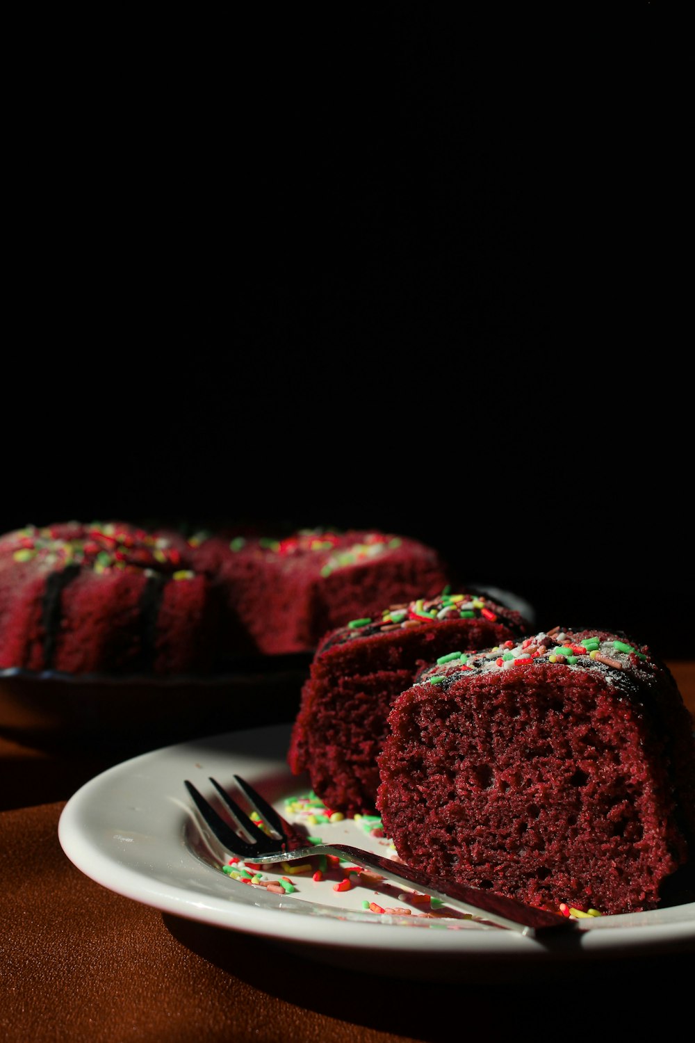 strawberry cake on white ceramic plate