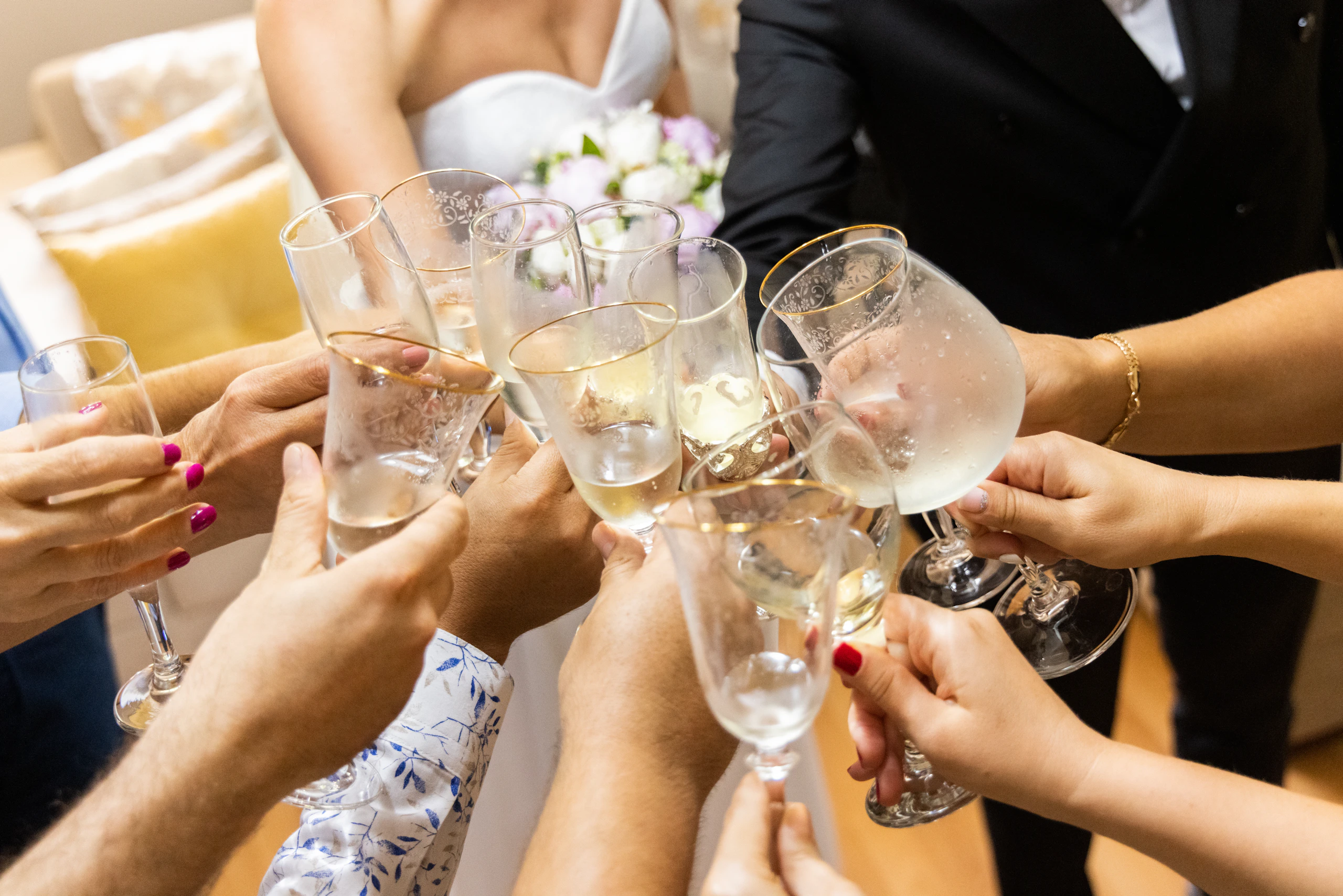 Guests raising champagne glasses