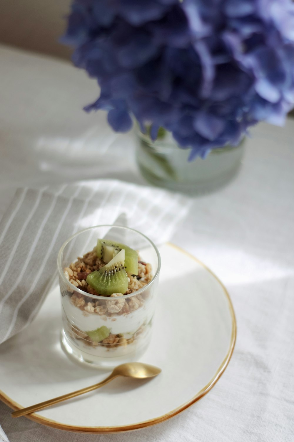 white and blue floral ceramic bowl with ice cream