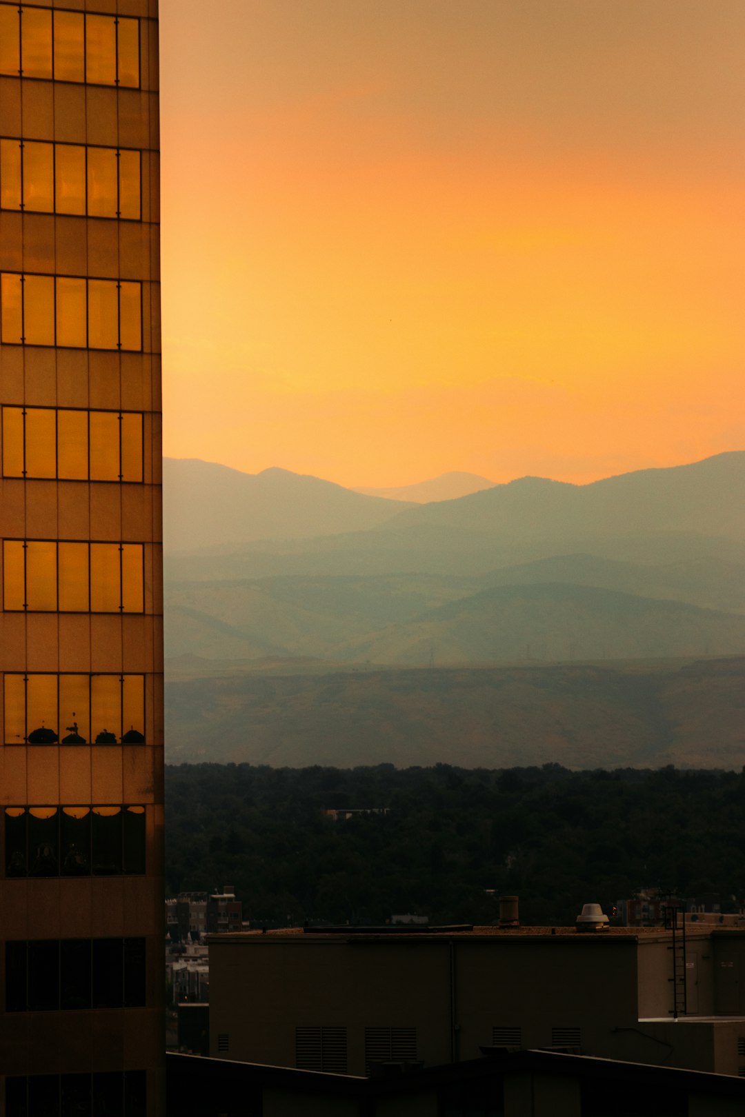 brown and white building near mountain during daytime