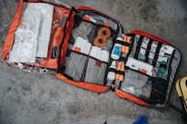 Close-up of VitalAid training materials showing detailed first aid manuals and branded equipment.
