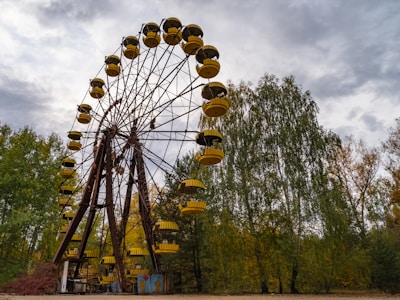 brown and white ferris wheel under blue sky during daytime