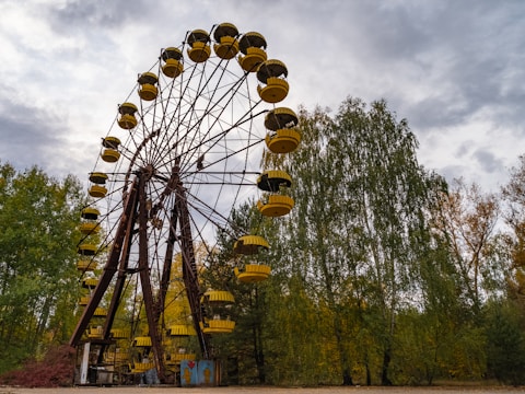 brown and white ferris wheel under blue sky during daytime
