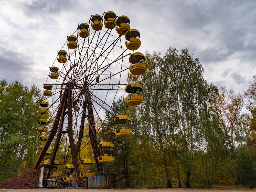 brown and white ferris wheel under blue sky during daytime