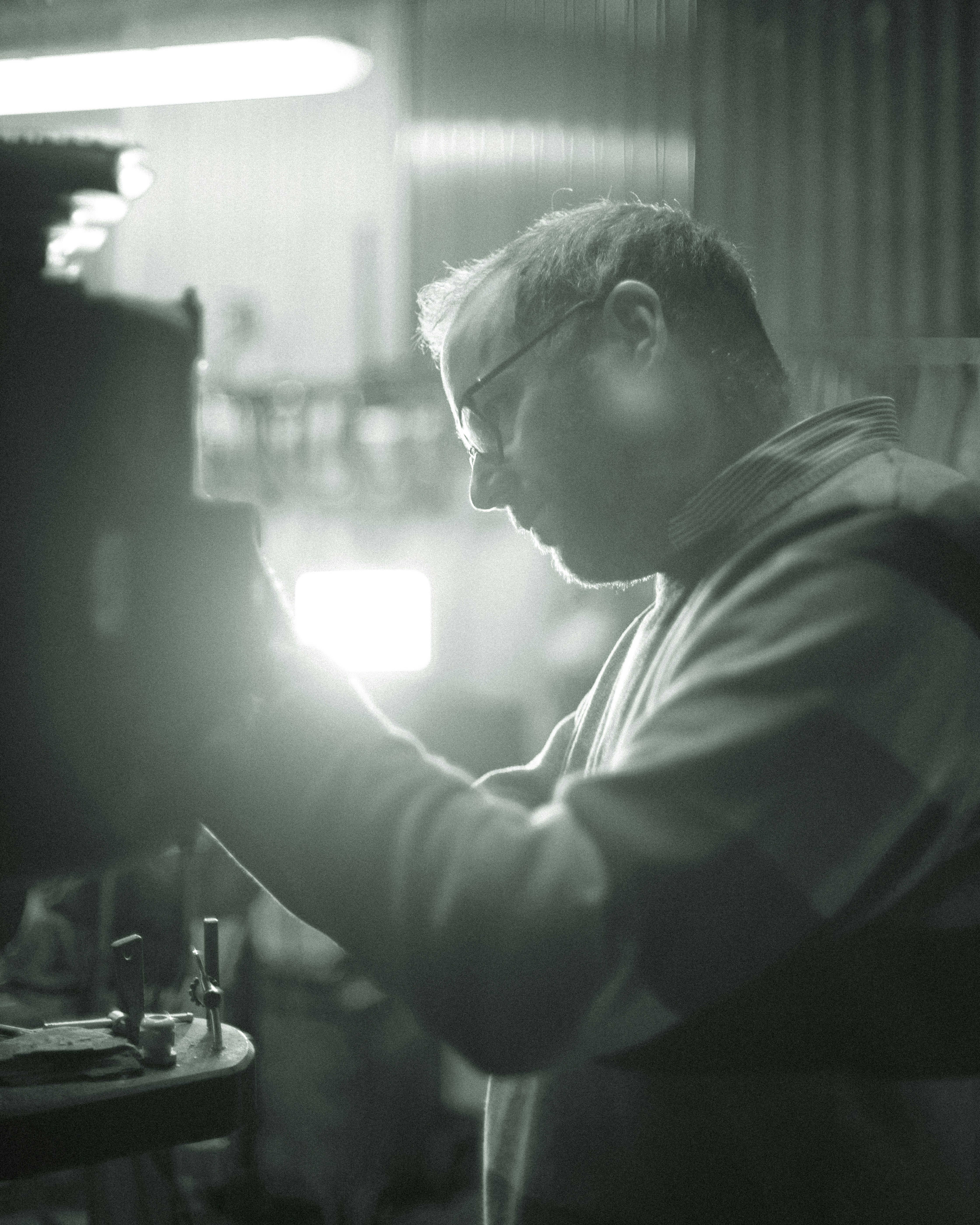 man in black shirt sitting on chair