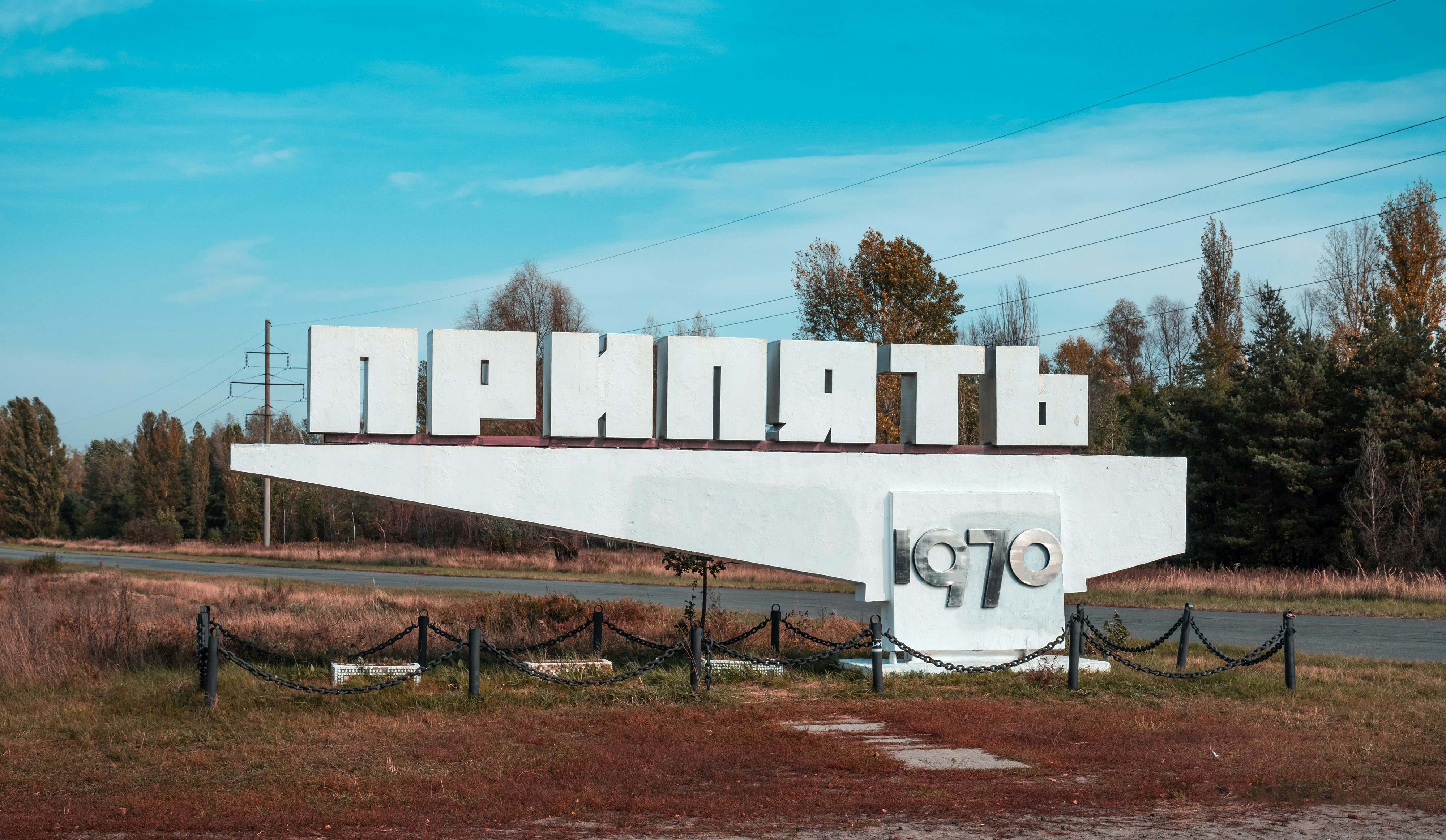 white concrete wall under blue sky during daytime