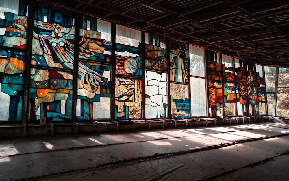 blue and brown wooden framed glass window