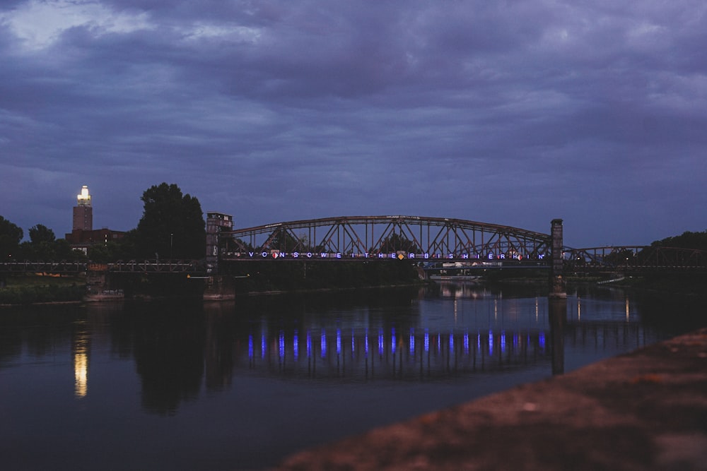 bridge over water during night time